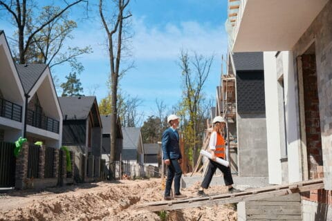 construction worker with lawyer on residential site