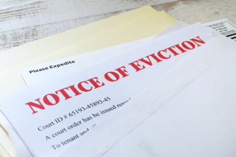 Side angle view of an official court ordered Eviction Notice in an envelope